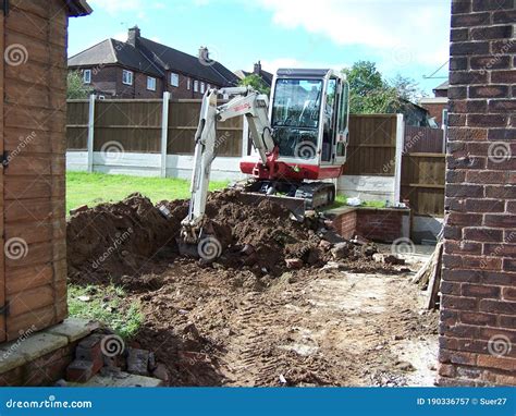 digging foundations with mini digger|digging a footing for foundation.